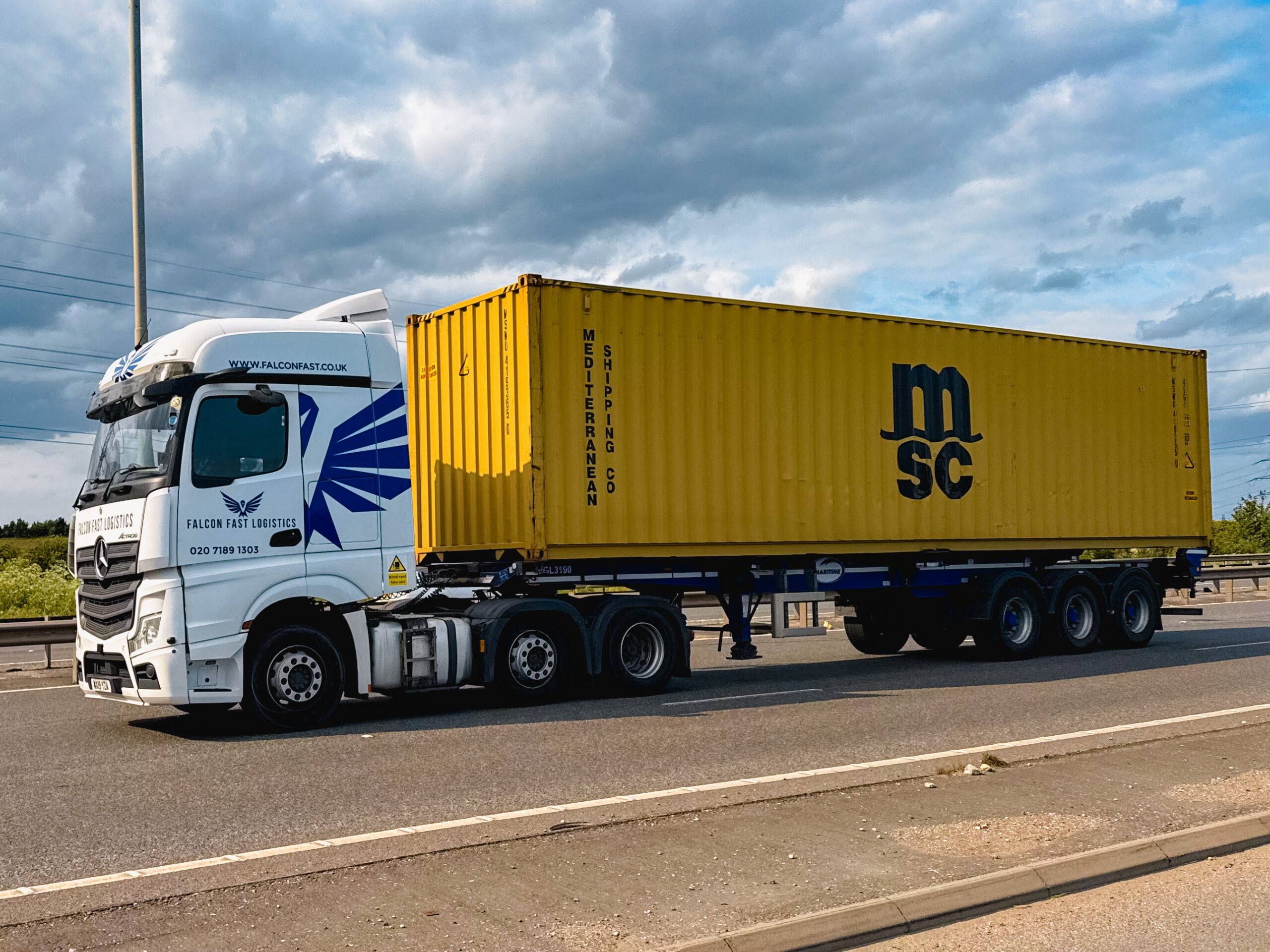 Falcon truck hauling a 40ft container on the motorway